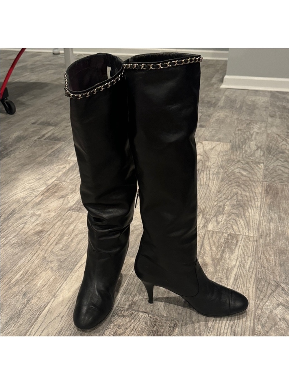 CHANEL Black Knee-High Stiletto Boots with Chain Trim